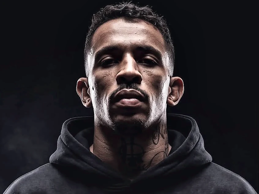 Carlos “The Nightmare” Prates in a black hoodie, studio portrait